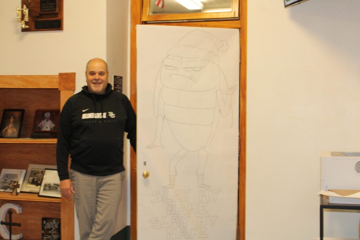 12.19.24
Billings Central teacher, Mr. Derrig in front of his Christmas decorated door