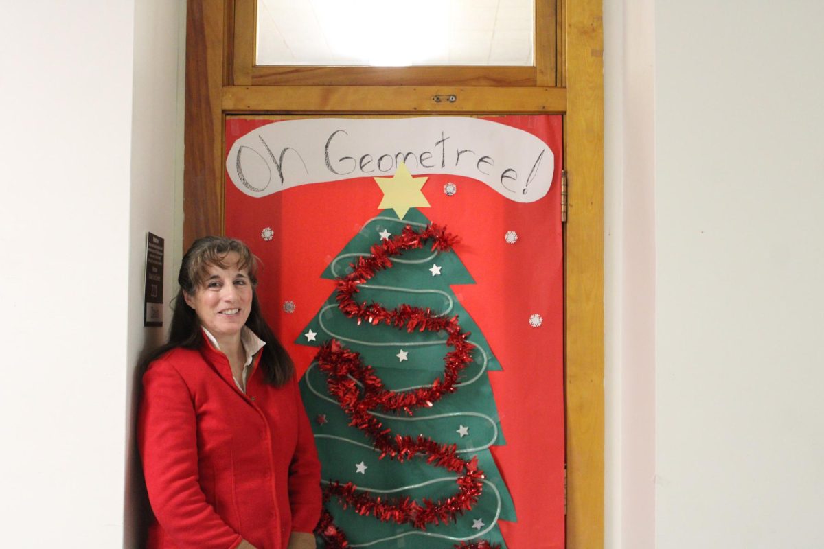 12.19.24
Mrs. Davis, a math teacher, in front of her Christmas-themed door