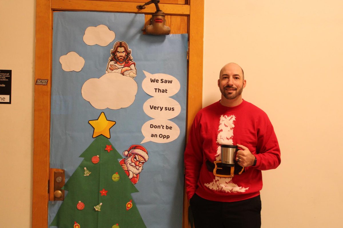 12.19.24
Mr. Osborne, a business teacher, in front of his Christmas decorated door