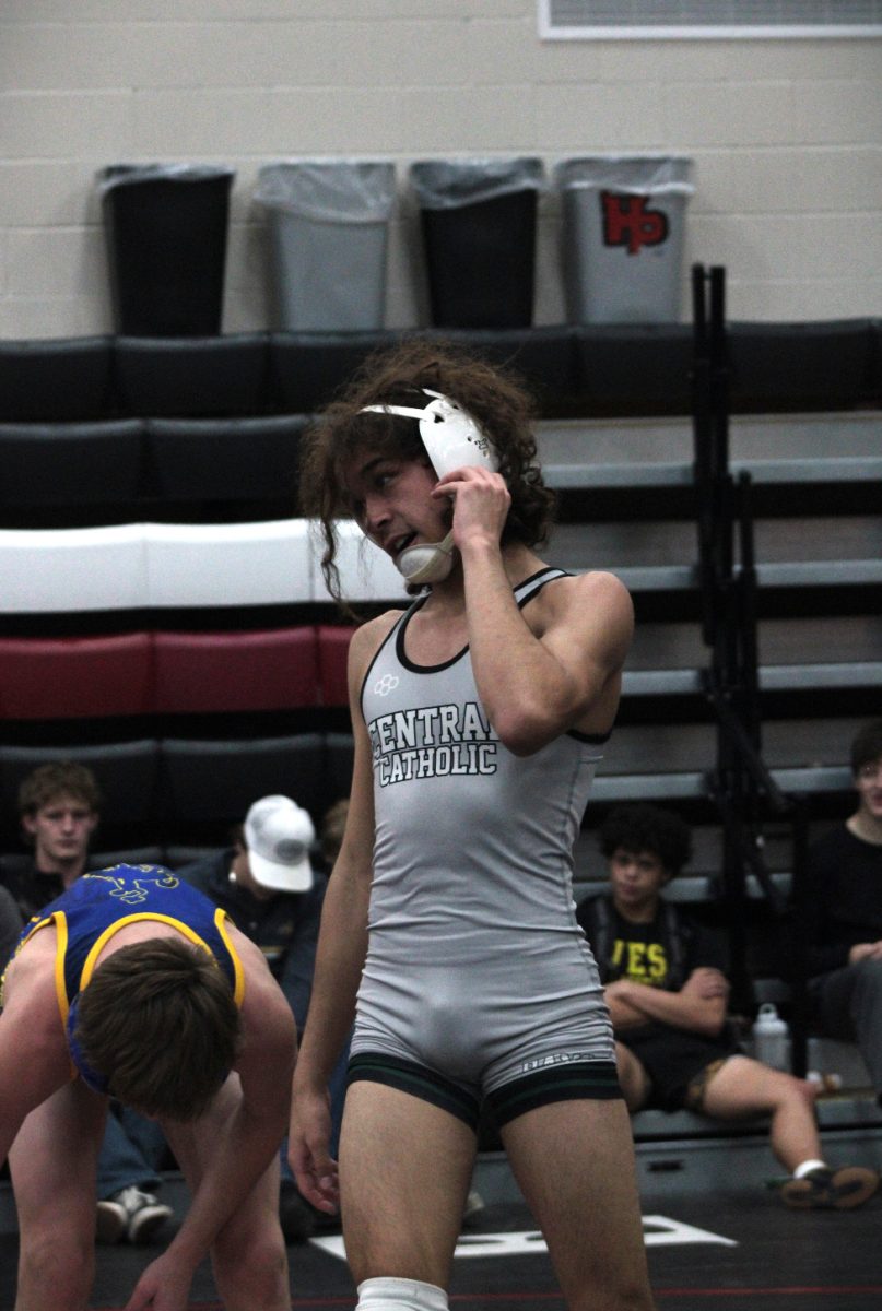 12.21.24
Junior Aramis Rivera fixes headgear during the Huntley Project Invitational