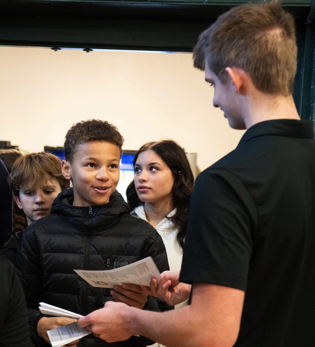 1.29.25
Student passing pamphlets at mass.