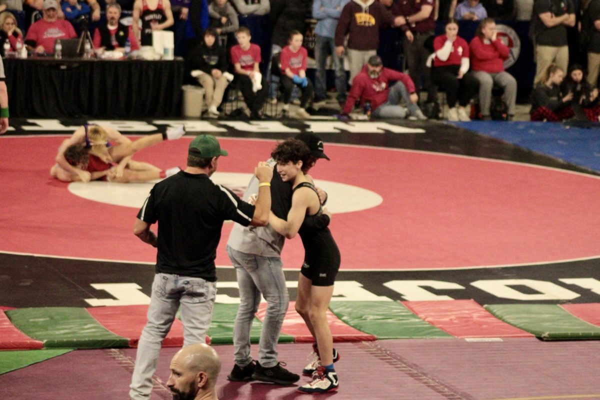 2.14.25
Freshman Kaius Rivera celebrating a semifinal win with coach Jacob Morgan at the MHSA All Class State Wrestling Tournament