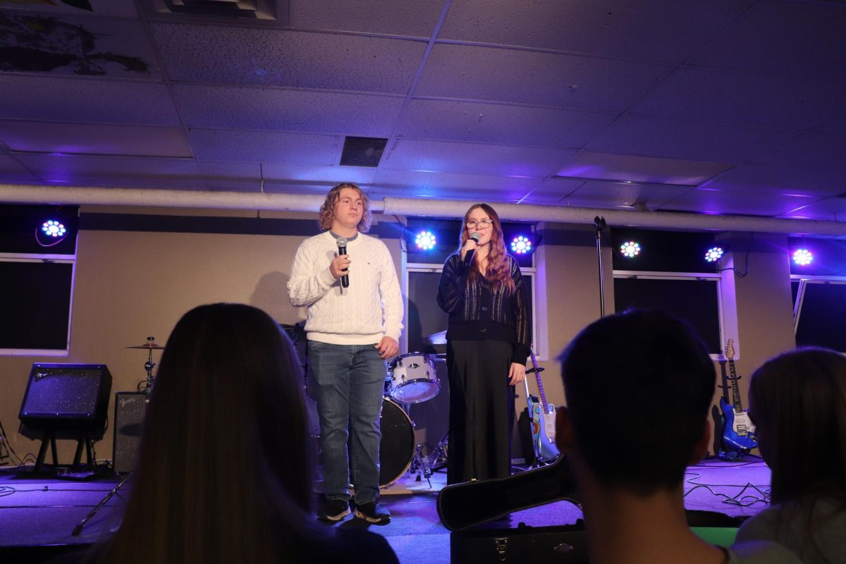 2.21.25
Senior Ellis Tillery and sophomore Vivian Hastings singing a duet at open mic night and the art gala.