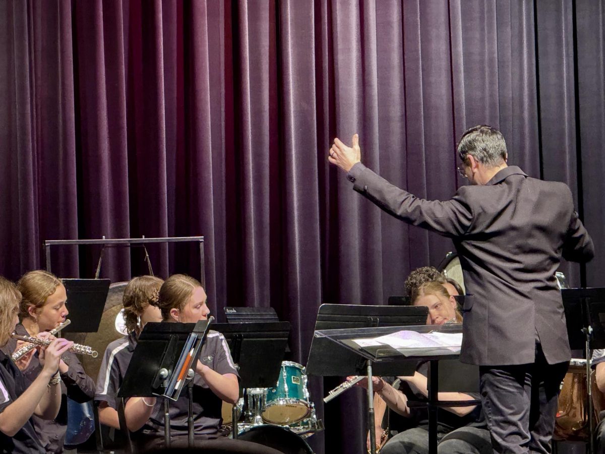 5.10.25 
Director, Branden Martinez with Central’s Band.  