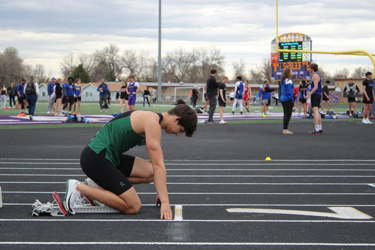 4.29.25 Junior William Snell lines up at the starting line. 