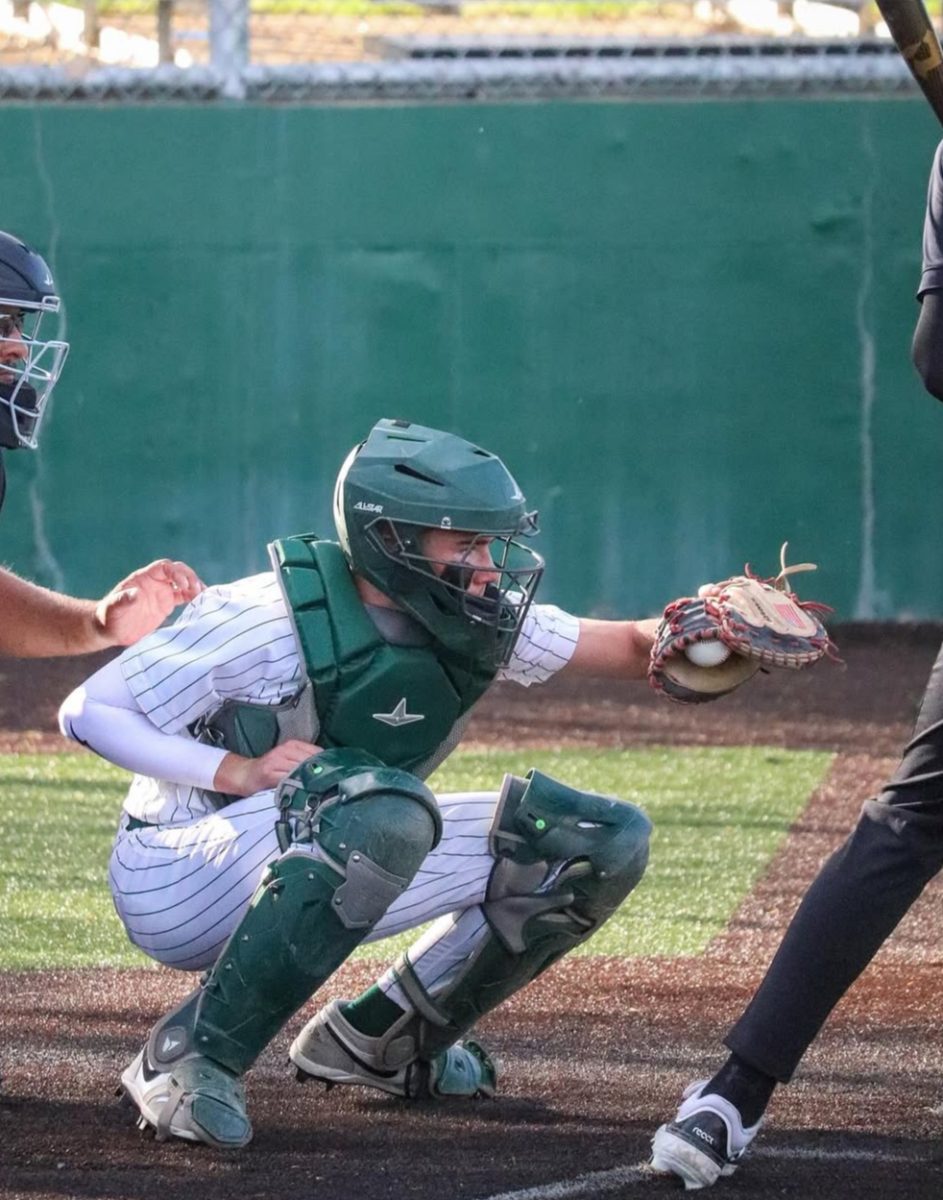5.9.25 Sophomore Matteo Harris playing catcher in the game against Billings West. 