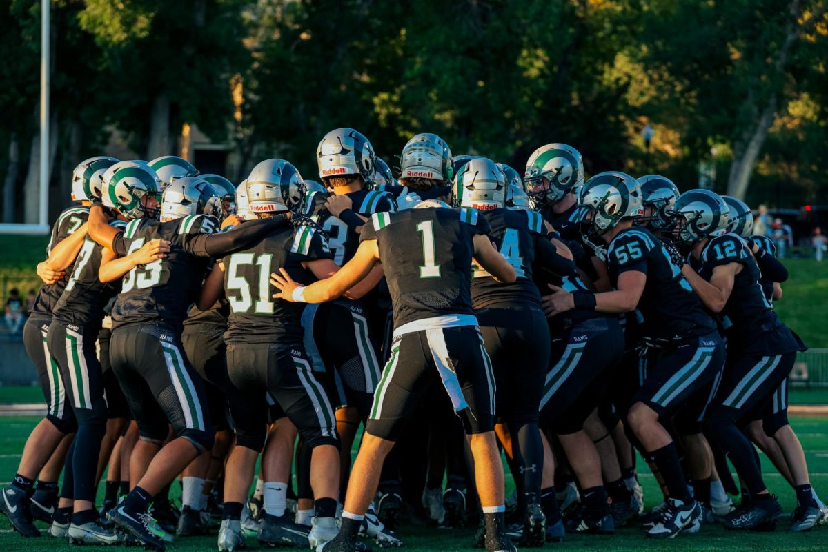 9.5.25
The Rams participating in their signature pregame huddle at their first home game of the season.