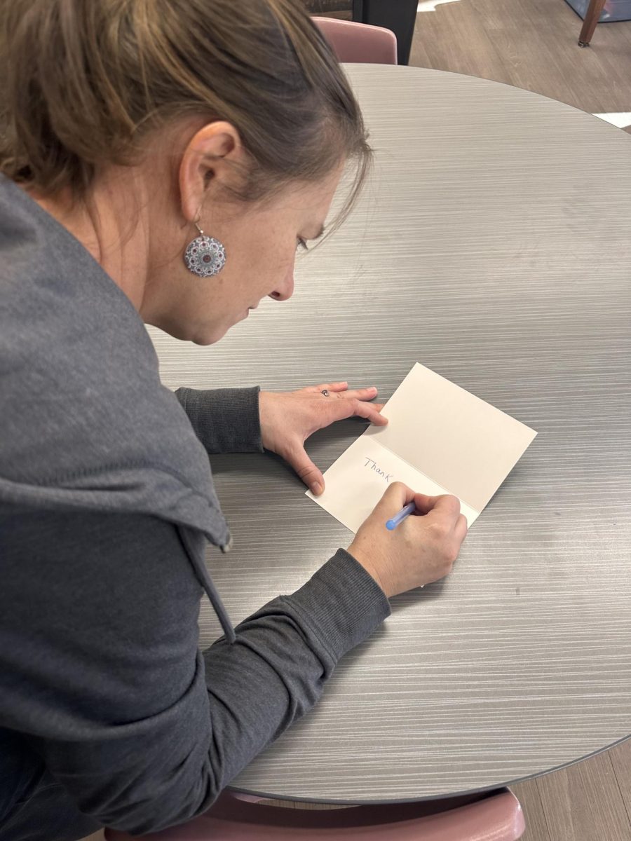 10.30.25 Mrs. Cunningham writing a thank you note to Rams Day of Giving doners