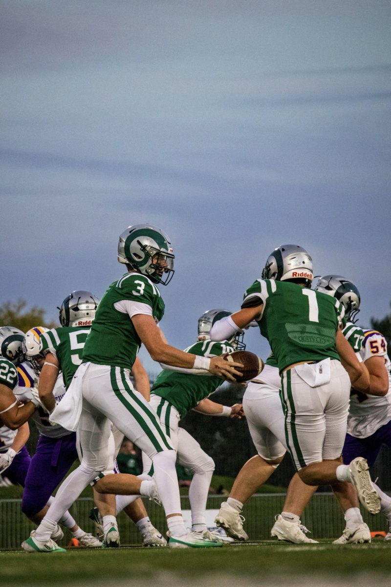 9.19.25 Senior Howie Martin handing off the ball to senior Adyen Salter during a game Vs Laurel 