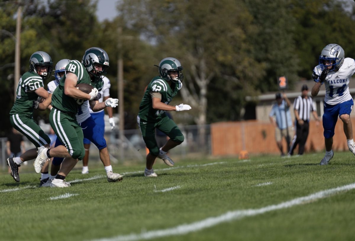 9.2.25 Sophomore Bauer Beckwith runs the ball against Skyview. 