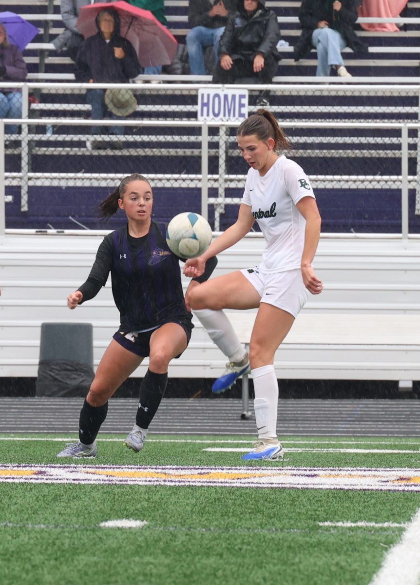 10.4.25 Senior Cece Hope maneuvers the ball around a Laurel defender. 
