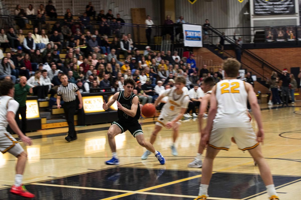 12.16.25
Billings central player number 4 Cy Hansen in basketball match against West.