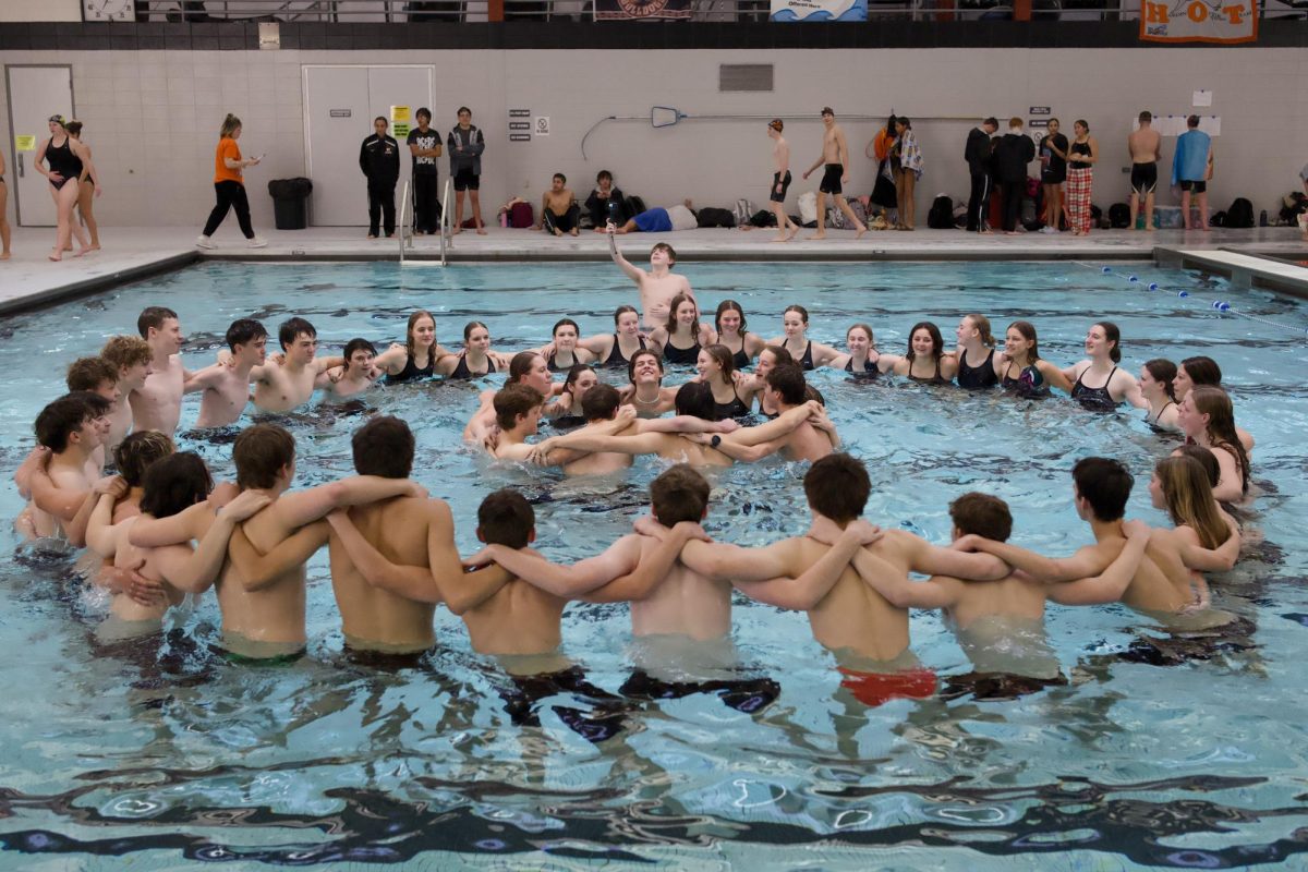1.9.26 The Central swim team performing a cheer in the pool at Hardin.