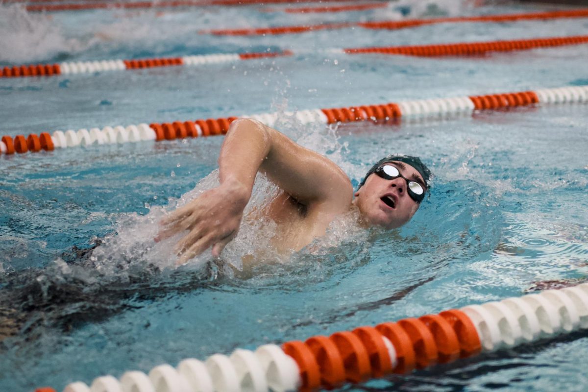 1.9.26
Sophomore Aiden Mclain taking in breath mid-stroke as he continues on in his 100m freestyle race.