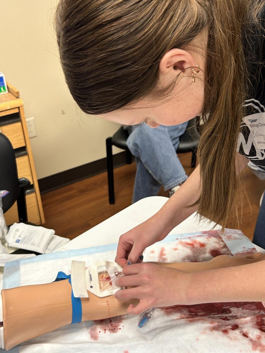 2.23.26
Junior, Bellamy Harada practicing drawing blood at the blood draw symposium.