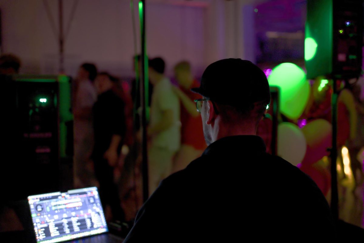 2.7.26. Mr. Martinez running the DJ booth at the sweethearts dance. 