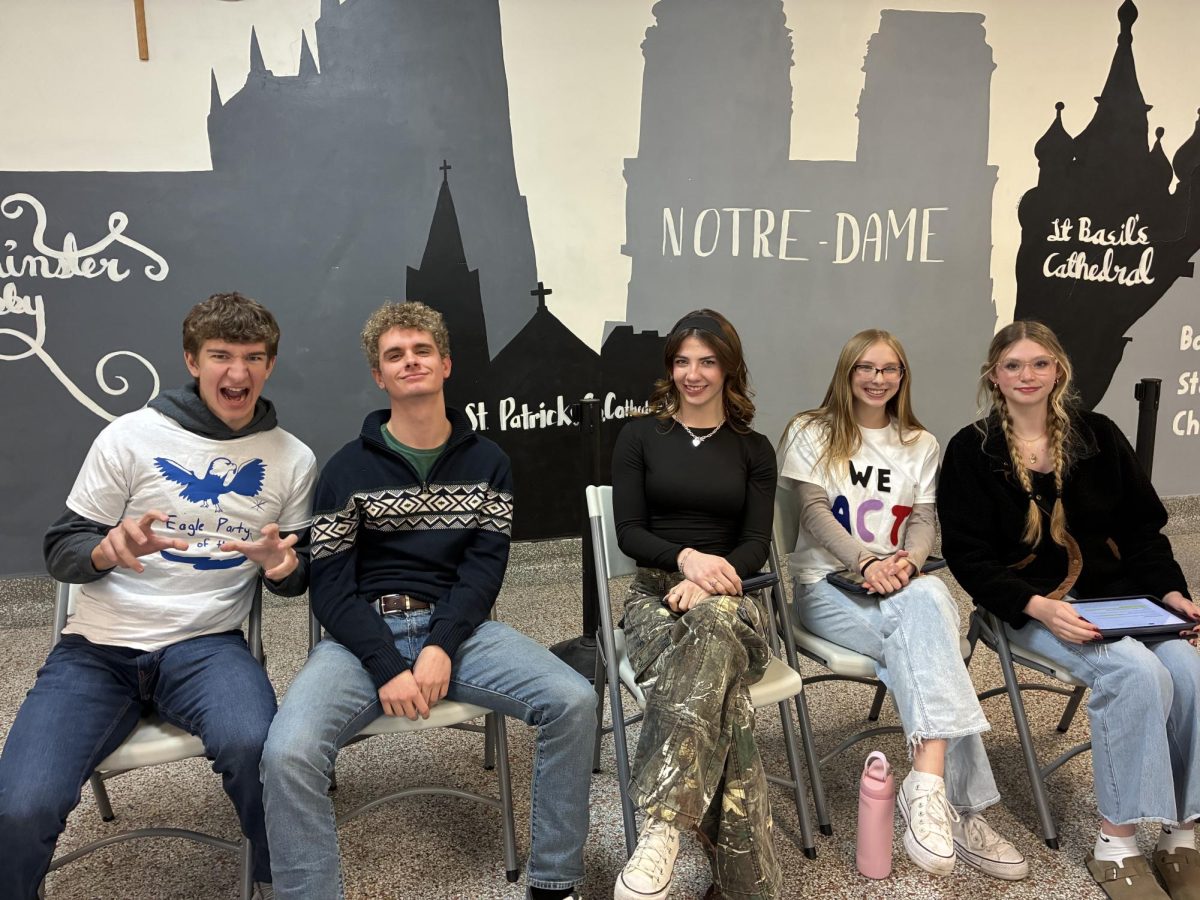 1.13.25
(L to R) Seniors, Landon Hughes, Alex Johnson, Cecily Hope, Brynn Soggard, and Samantha Deitsch sitting while preparing to give their presidential campaign speeches. 