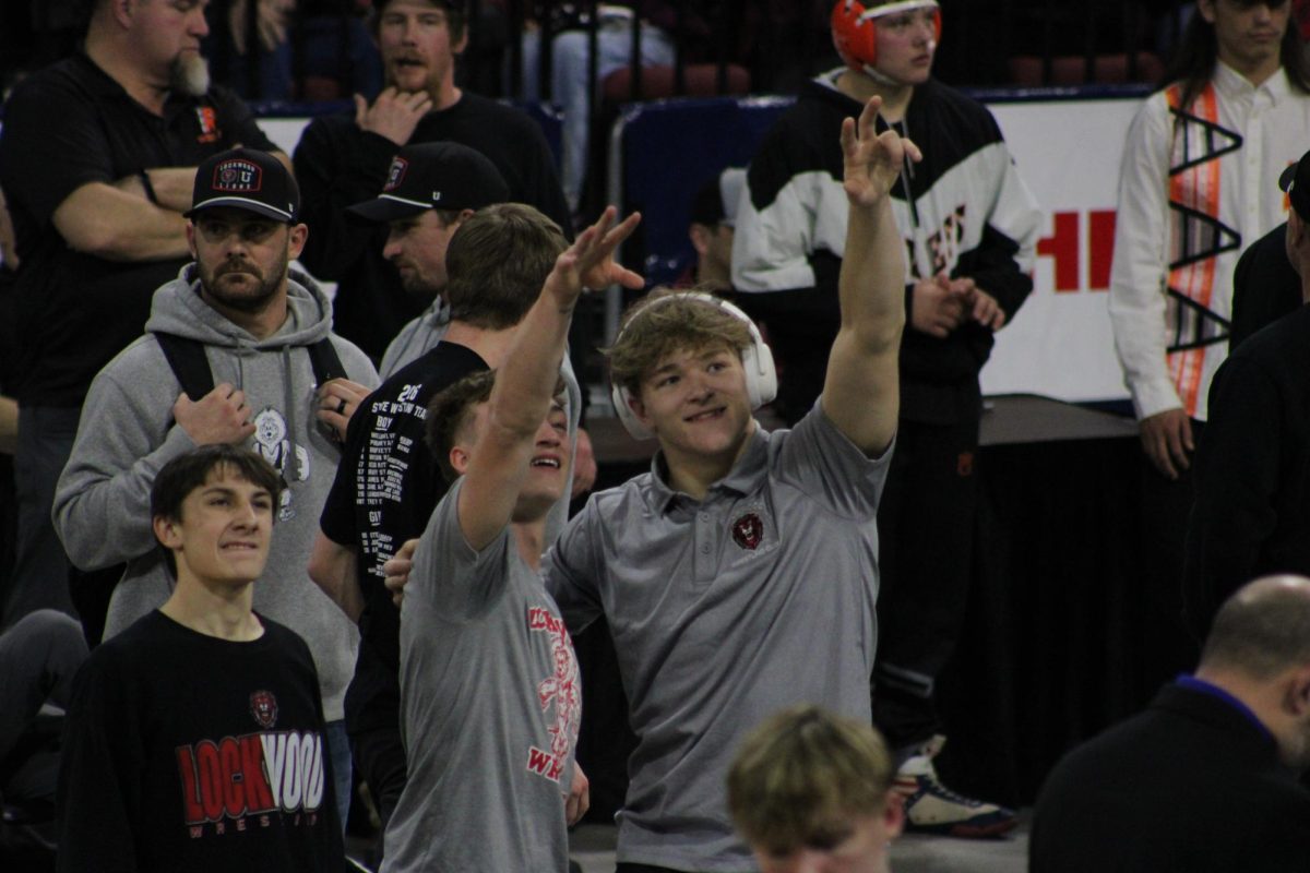 2.21.26
Lockwood’s Philip Bryant (L) and James Mills (R) look to the stands during finals warmups at the MHSA State Wrestling Tournament. Both went on to become state champions