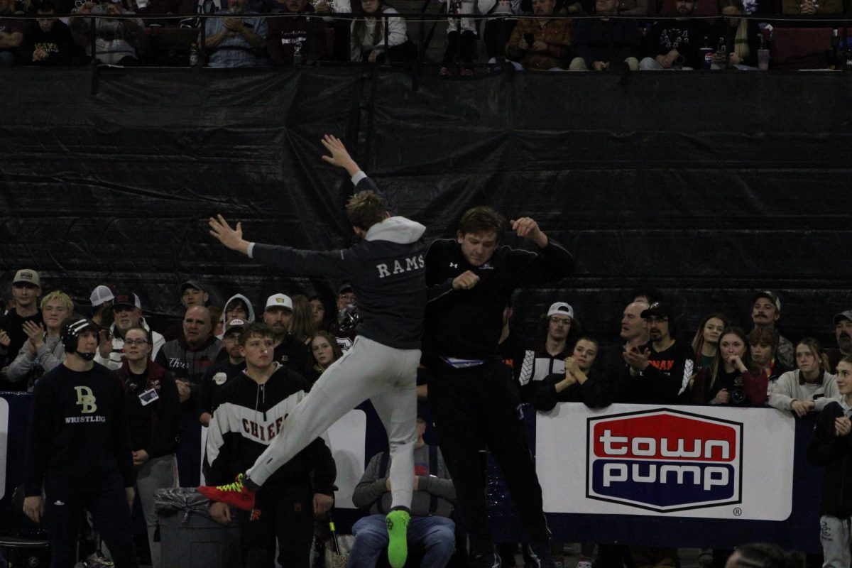 2.21.26
Trystan Knight (L) goes up for a shoulder bump with Corvallis’ Jesse James during the Parade of Finalists at the MHSA State Wrestling Tournament
