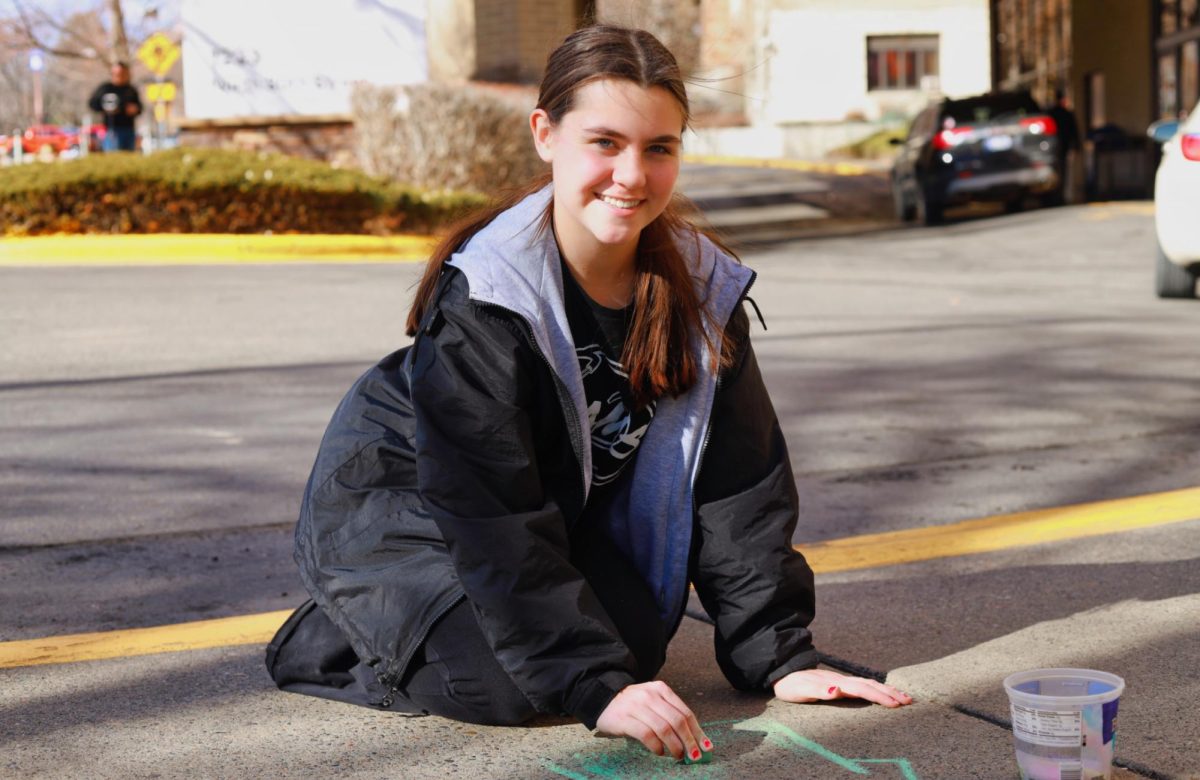 2.15.26
Freshman, Brynn Lague beginning her drawing of medical scrubs outside of Intermountain Health. 