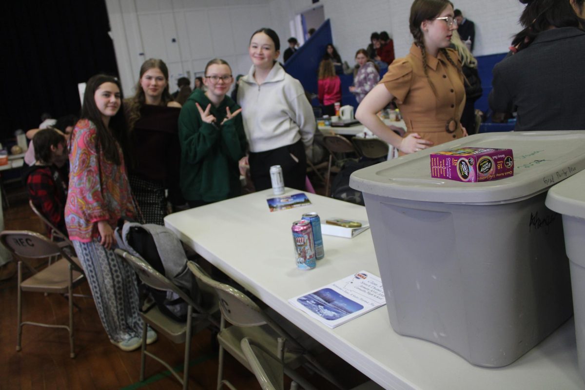 From L-R Freshman, Brynn lague, Lila schuppe, Reagan bullock, and Morgan apphelt posing for a picture at the team’s table for state.(January 30th)