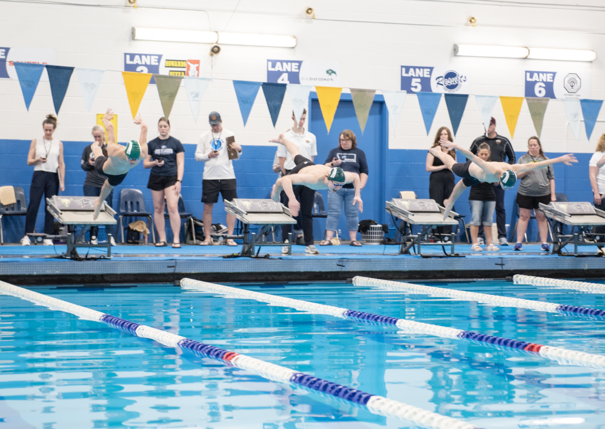 2.14.26
(Left to Right) Senior Greyson Piseno, Junior Jonas Johnson, and Freshman McKade Vaira explode off of the blocks to start the Boys 200 Individual Medley Finals. 