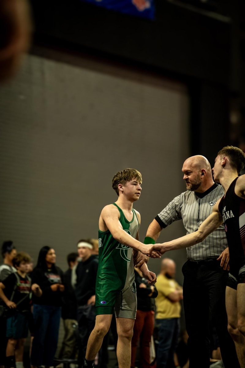 3.28.26
Junior Owen Wegner shaking his opponents hand after his championship match at AAU State at the Metra