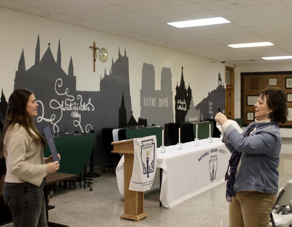 3.3.26
(From L to R) 
Photo of Emily Day posing for a photo while her mom Mrs. Day takes a photo. 