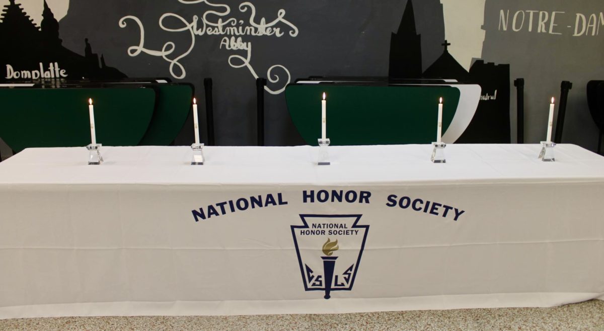 3.3.26
Candles that represent the light of knowledge, scholarship, leadership, service, and character.