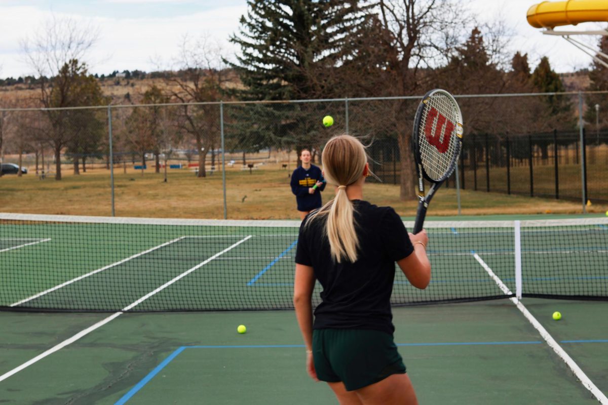 3.19.26
In focus, junior Avery Sorenson, warming up with senior Teaghan Vaira. 