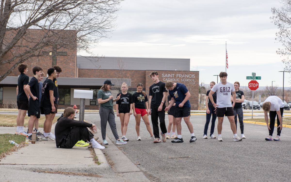 3.18.26
Billings Central Theology teacher and sprinting coach Mrs. Krista Wahl gives advice to Central sprinters at track practice. 