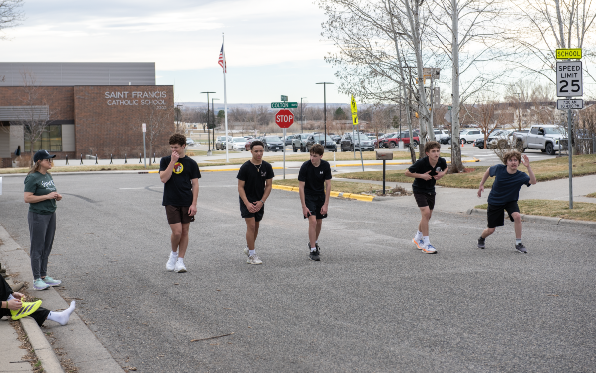 3.18.26
Freshman track athletes line up to sprint up a hill at track practice. 