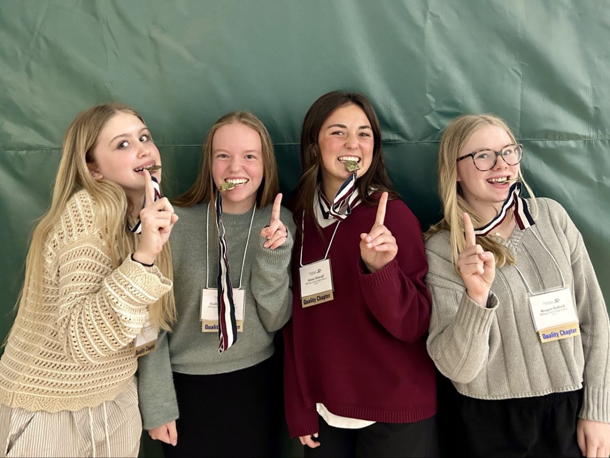 4.1.26 
(From L to R) Freshmen, Teddy Kadrmas, Haylie Swenson, Alana Metcalf, and Reagan Bullock posing for a celebratory photo after placing 1st in the PSA category at SLC.