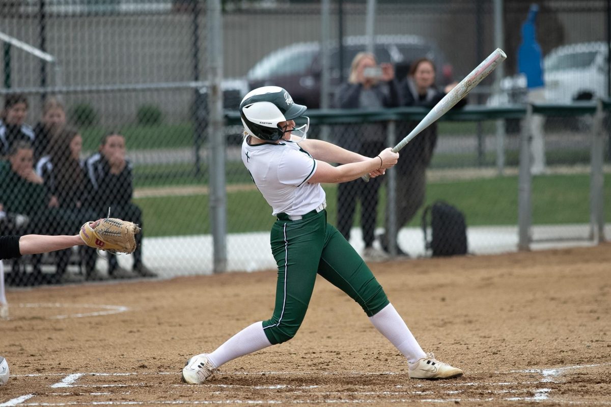 4.13.26 Junior Carlee Hofer swings at the ball in the game against Laurel on Monday. 