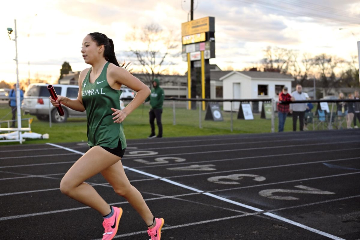 4.14.26 Junior Karis Brightwings sprinting through the finish line for the last leg of the 4 x 4 relay. 