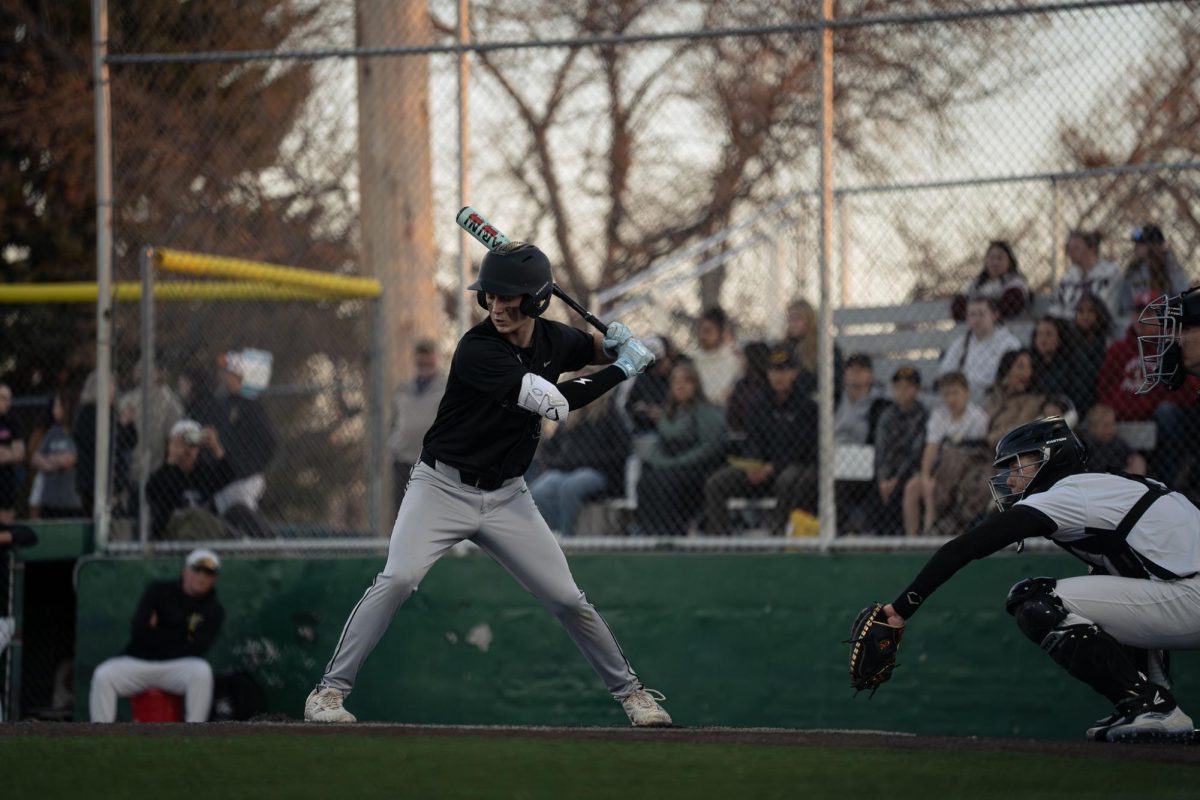 3.27 Sophomore Porter Dalhberg standing over the plate looking for a hit in a game agianst West