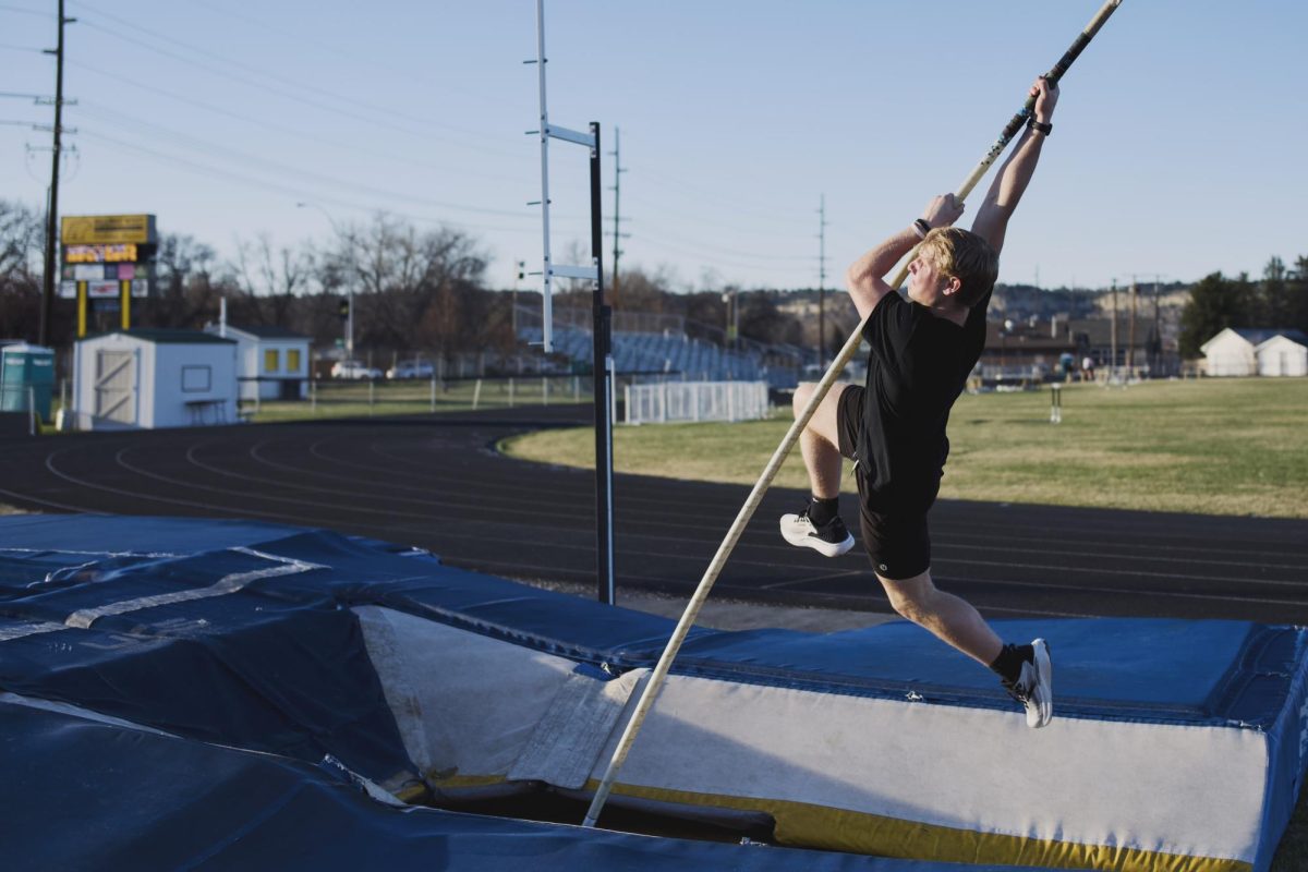 3.27.26. Sophmore Bauer Beckwith soaring into the air as he prepares for his track meet the following day. 