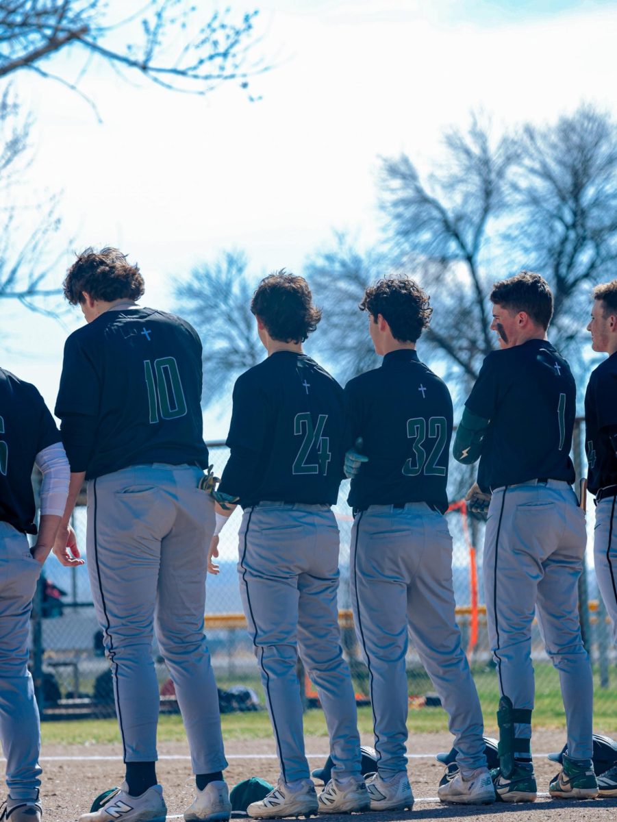 3.3.26
L to R: Brayden West, Essai Flores, Porter Dahlberg, and Matteo Harrisstanding in line for starting line up announcements against the Huntley Red Devils in Huntley 