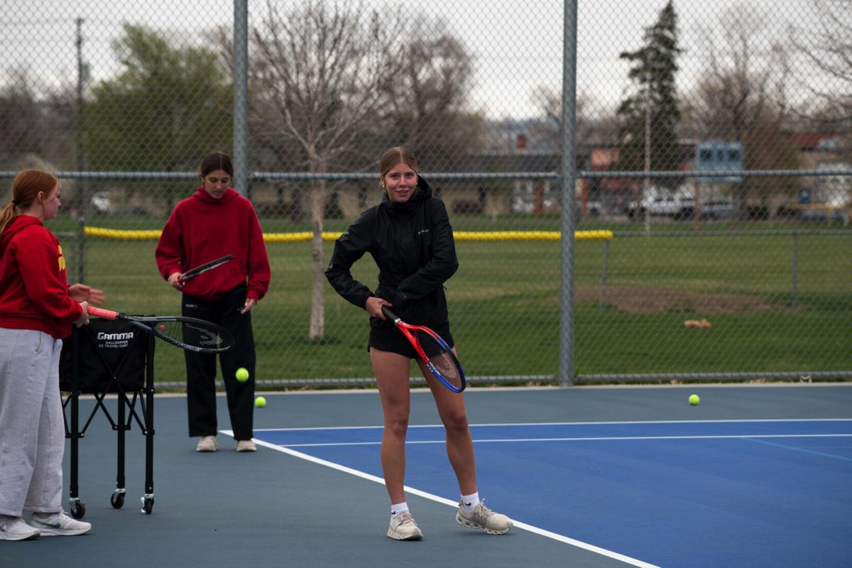 4.16.26
(L to R) 
Freshman Victoria Willis, Junior Abigail Breetz, and Elizabeth Baker preparing to serve at tennis practice. 