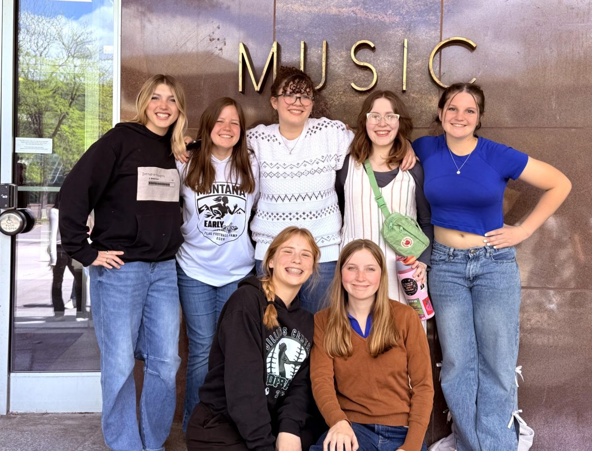 5.7.26
A group of girls pose for a picture before their music workshop at the University of Montana.
